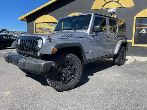 2016 Jeep Wrangler Unlimited for sale at BELOW BOOK AUTO SALES in Idaho Falls ID