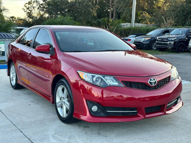 2014 Toyota Camry for sale at DJA Autos Center in Orlando, FL