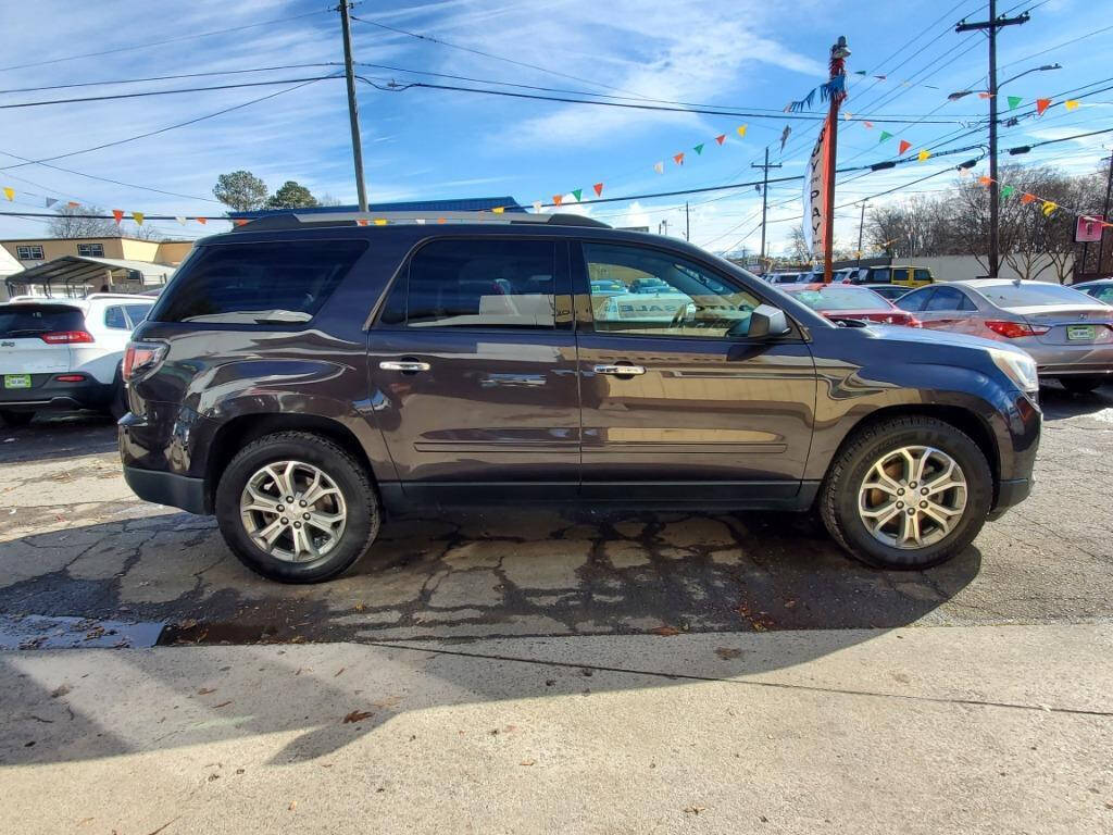 2014 GMC Acadia for sale at DAGO'S AUTO SALES LLC in Dalton, GA