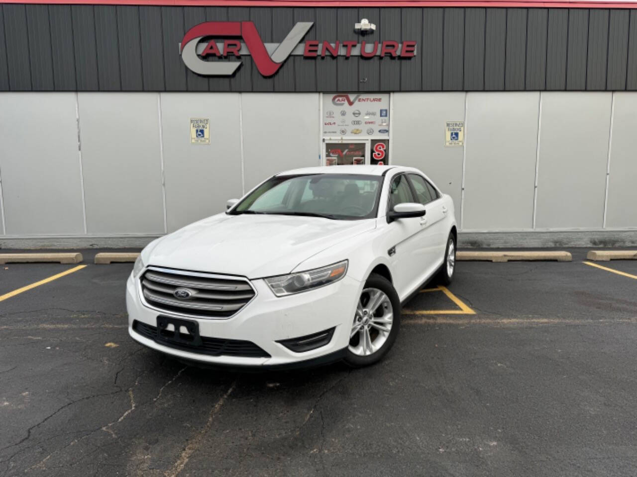 2014 Ford Taurus for sale at Carventure in Lansing, MI