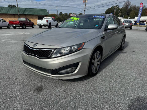 2011 Kia Optima for sale at Cars for Less in Phenix City AL