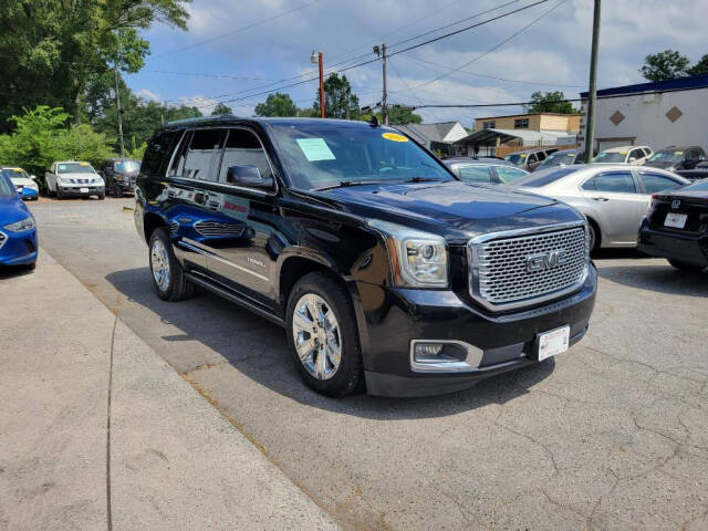 2015 GMC Yukon for sale at DAGO'S AUTO SALES LLC in Dalton, GA