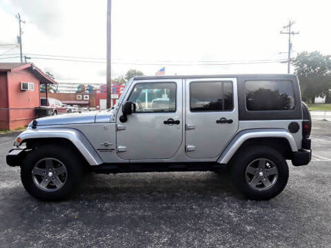 2013 Jeep Wrangler Unlimited for sale at Rons Auto Sales in Stockdale TX