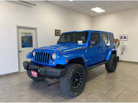 2014 Jeep Wrangler Unlimited for sale at DAN PORTER MOTORS in Dickinson ND