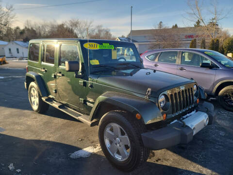 2011 Jeep Wrangler Unlimited for sale at R C Motors in Lunenburg MA