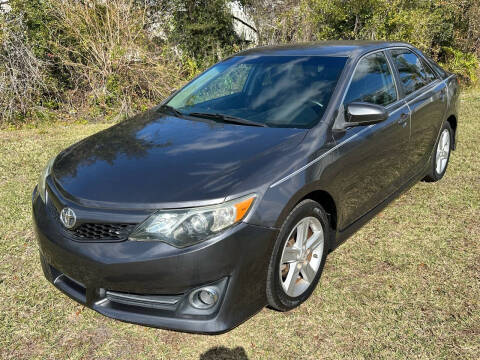 2014 Toyota Camry for sale at Velocity Autos in Winter Park FL