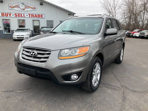 2011 Hyundai Santa Fe for sale at Steves Auto Sales in Cambridge MN