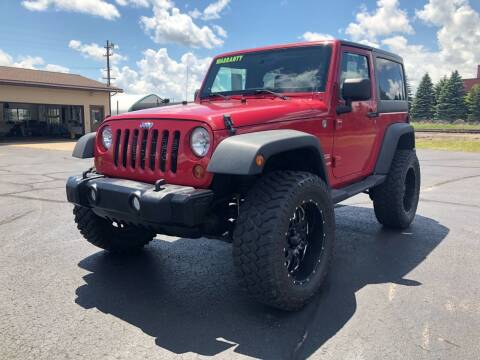 2012 Jeep Wrangler for sale at Mike's Budget Auto Sales in Cadillac MI