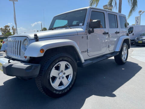 2012 Jeep Wrangler Unlimited for sale at CARSTER in Huntington Beach CA