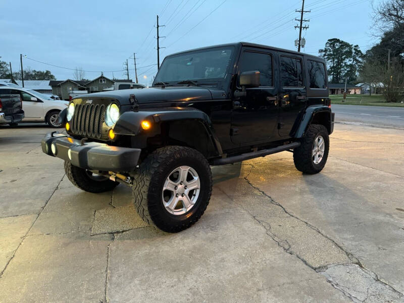 2013 Jeep Wrangler Unlimited for sale at Star Motorsports, LLC in Rayne LA