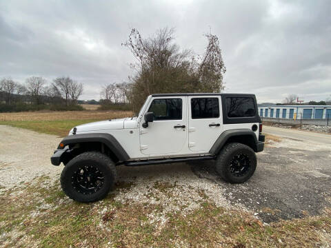 2013 Jeep Wrangler Unlimited for sale at Tennessee Valley Wholesale Autos LLC in Huntsville AL