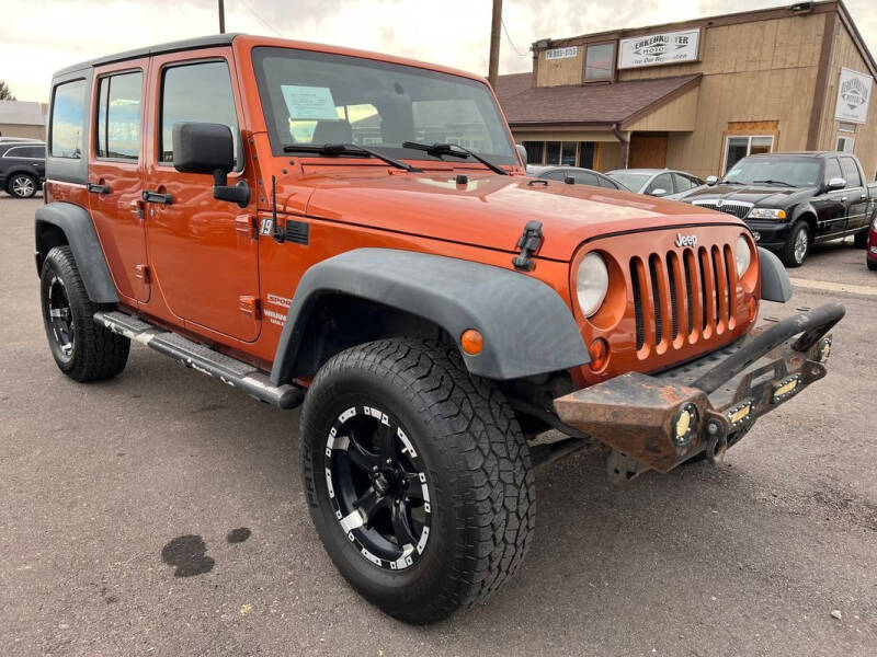 2011 Jeep Wrangler Unlimited for sale at BERKENKOTTER MOTORS in Brighton CO