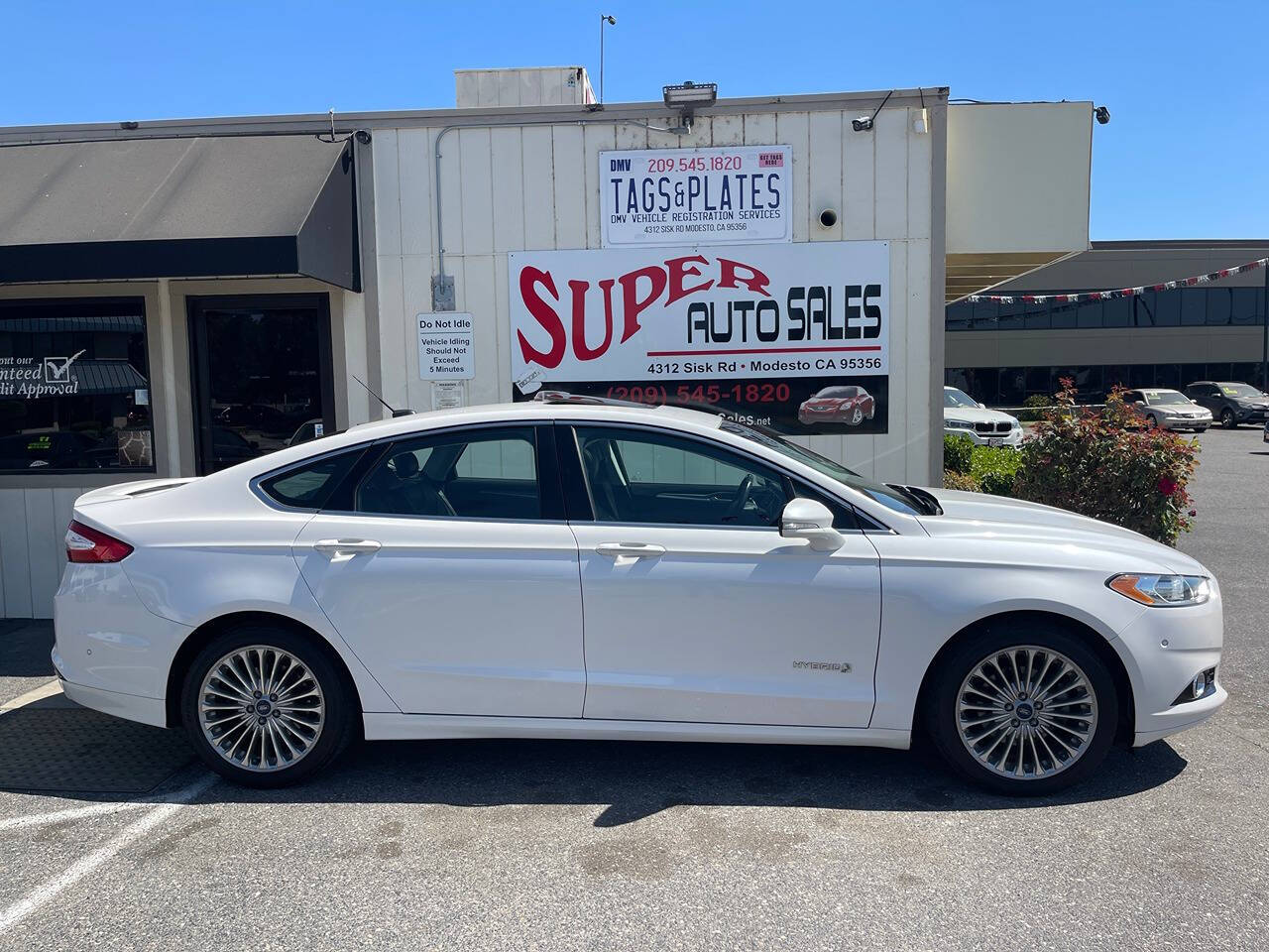 2014 Ford Fusion Hybrid for sale at Super Auto Sales Modesto in Modesto, CA