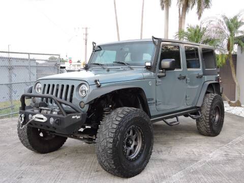 2014 Jeep Wrangler Unlimited for sale at Auto Whim in Miami FL