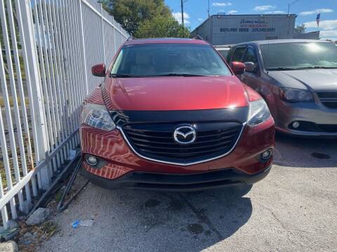 2015 Mazda CX-9 for sale at America Auto Wholesale Inc in Miami FL
