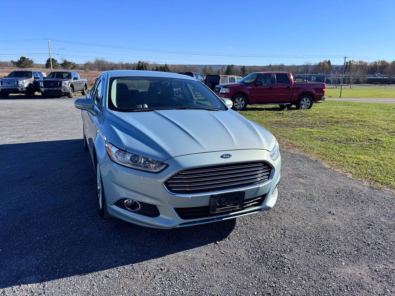 2014 Ford Fusion Hybrid for sale at Riverside Motors in Glenfield, NY