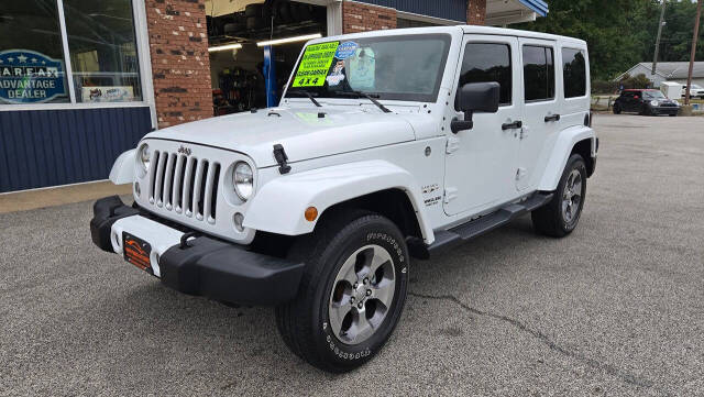 2016 Jeep Wrangler Unlimited for sale at North Ridge Auto Center LLC in Madison, OH