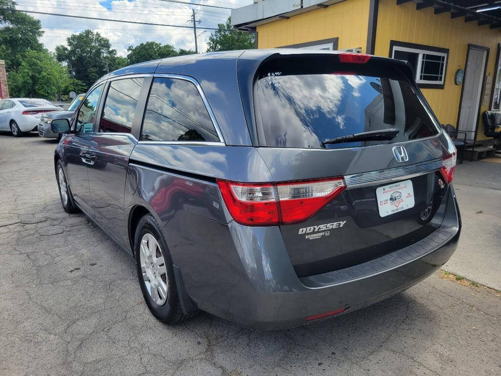 2012 Honda Odyssey for sale at DAGO'S AUTO SALES LLC in Dalton, GA