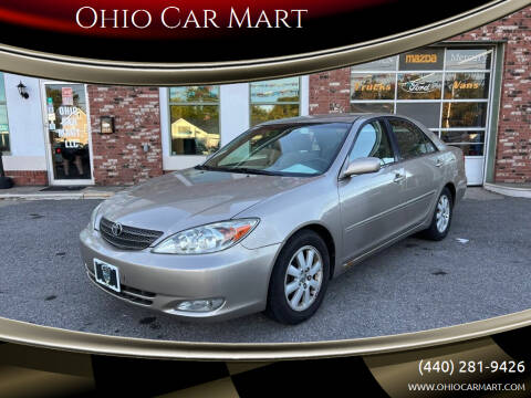 2003 Toyota Camry for sale at Ohio Car Mart in Elyria OH