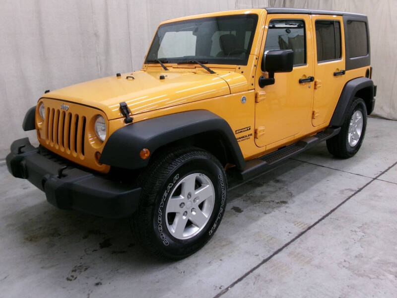 2013 Jeep Wrangler Unlimited for sale at Paquet Auto Sales in Madison OH