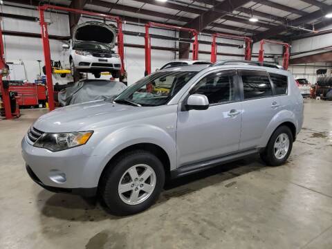 2009 Mitsubishi Outlander for sale at Hometown Automotive Service & Sales in Holliston MA