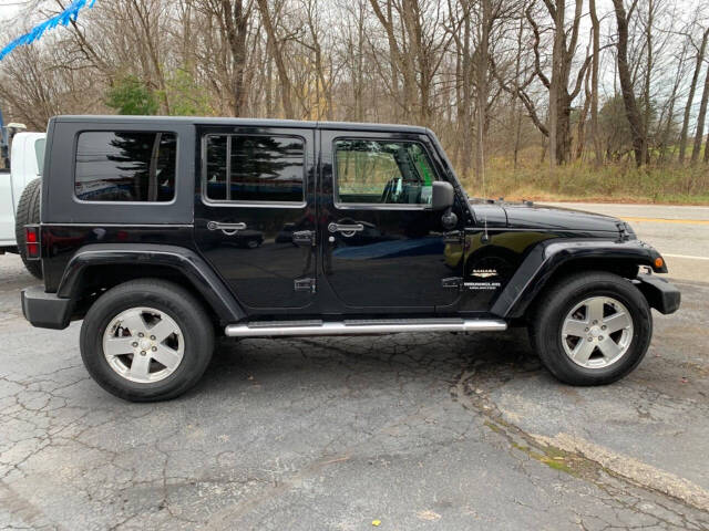 2009 Jeep Wrangler Unlimited for sale at Chuckie Bizzarro's Fleetwing Auto in Erie, PA