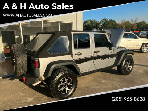 2015 Jeep Wrangler Unlimited for sale at A & H Auto Sales in Clanton AL