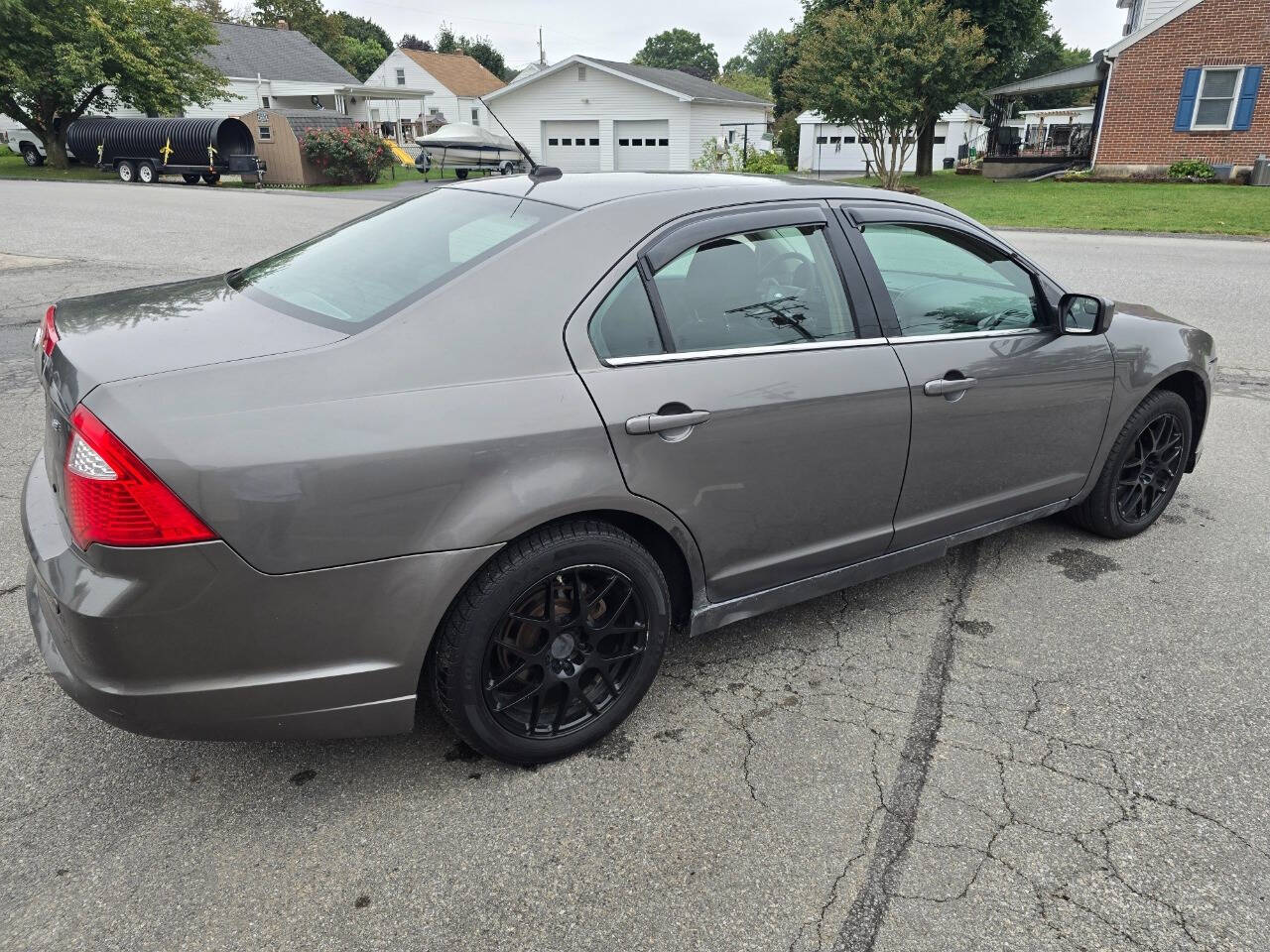 2011 Ford Fusion for sale at QUEENSGATE AUTO SALES in York, PA