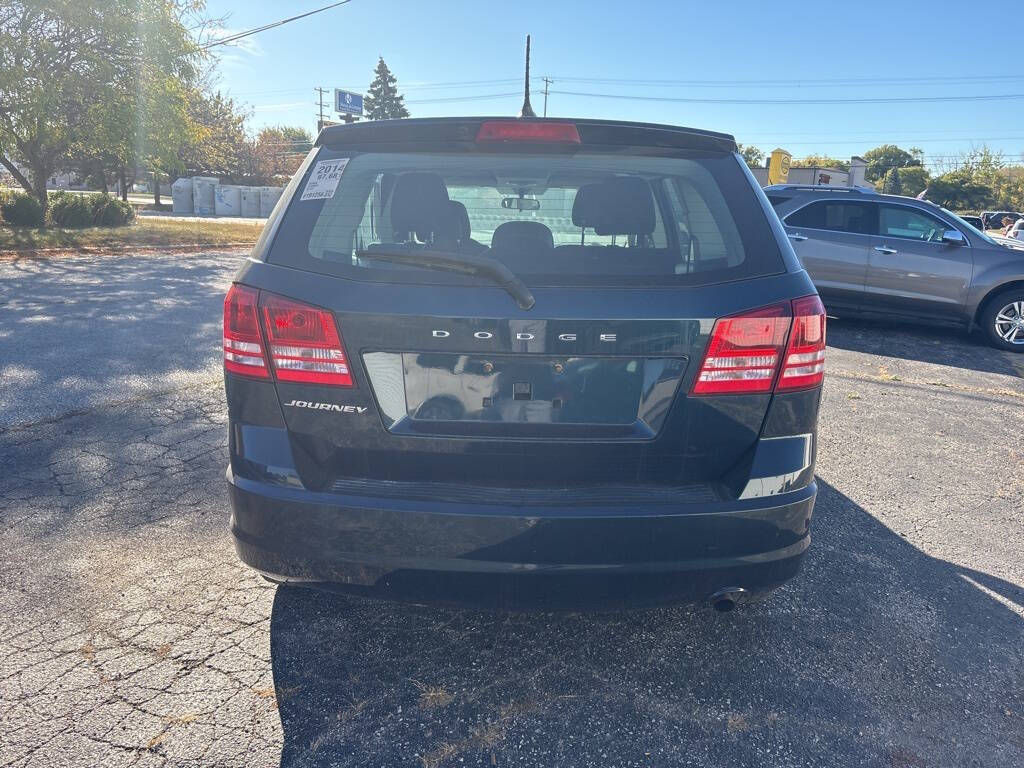 2014 Dodge Journey for sale at DECKER AUTO SALES in Bay City, MI