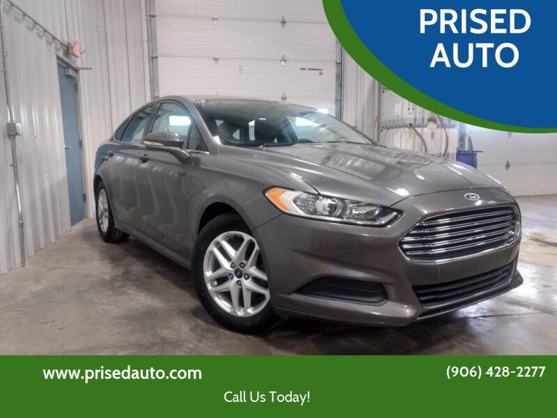 2014 Ford Fusion for sale at PRISED AUTO in Gladstone MI