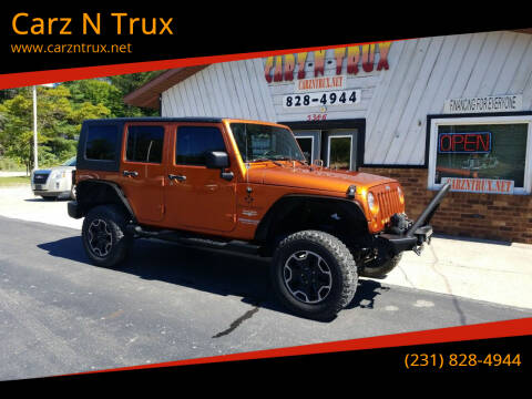 2010 Jeep Wrangler Unlimited for sale at Carz N Trux in Twin Lake MI
