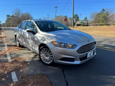 2016 Ford Fusion Hybrid for sale at THE AUTO FINDERS in Durham NC