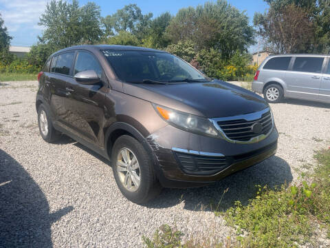 2011 Kia Sportage for sale at HEDGES USED CARS in Carleton MI