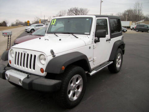 2013 Jeep Wrangler for sale at The Garage Auto Sales and Service in New Paris OH