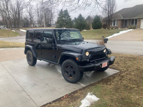 2015 Jeep Wrangler Unlimited for sale at RT Auto Center in Quincy IL