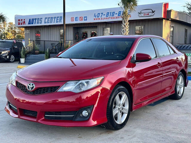 2014 Toyota Camry for sale at DJA Autos Center in Orlando, FL