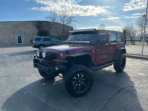 2011 Jeep Wrangler Unlimited for sale at Stark Auto Mall in Massillon OH