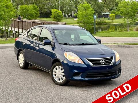 2014 Nissan Versa for sale at EASYCAR GROUP in Orlando FL
