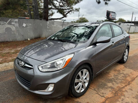 2014 Hyundai Accent for sale at Mandingo's Automotive & Sales LLC in Snellville GA