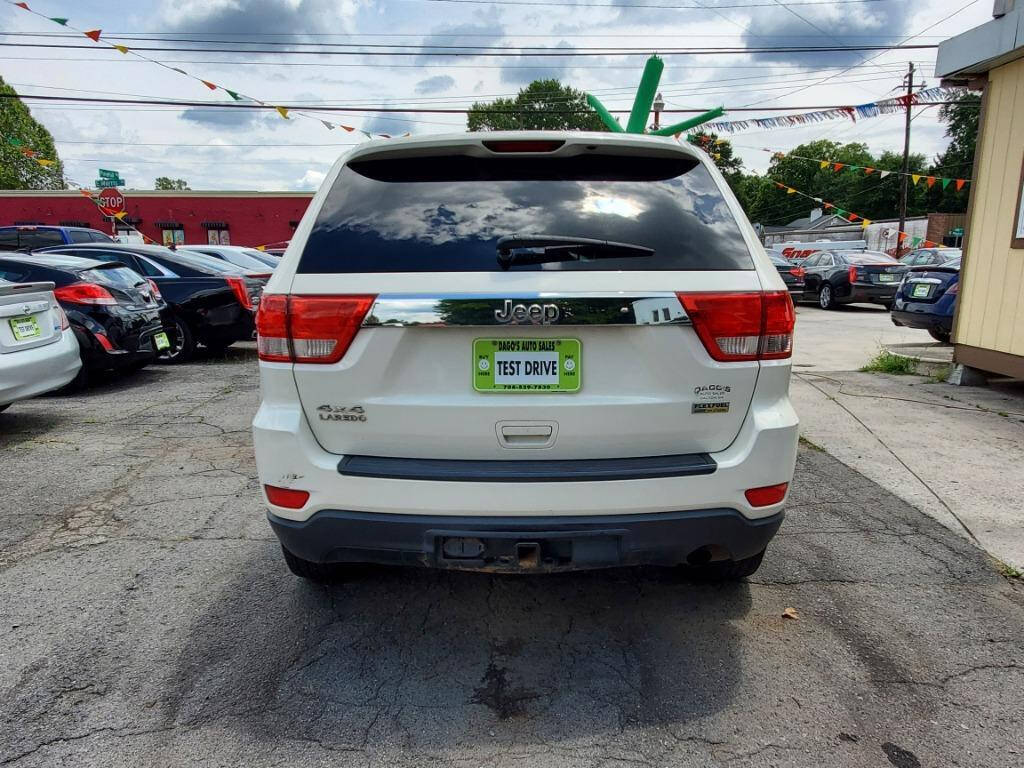 2011 Jeep Grand Cherokee for sale at DAGO'S AUTO SALES LLC in Dalton, GA