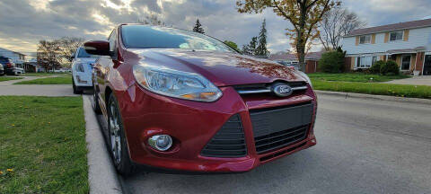 2014 Ford Focus for sale at QUEST AUTO GROUP LLC in Redford MI