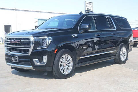 2021 GMC Yukon XL for sale at STRICKLAND AUTO GROUP INC in Ahoskie NC