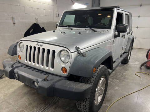 2011 Jeep Wrangler Unlimited for sale at Schmidt's in Hortonville WI