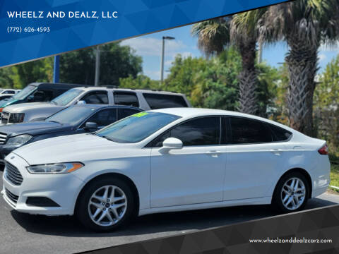 2013 Ford Fusion for sale at WHEELZ AND DEALZ, LLC in Fort Pierce FL