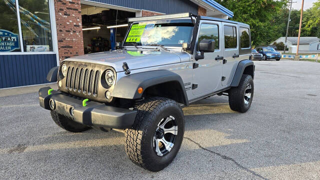 2014 Jeep Wrangler Unlimited for sale at North Ridge Auto Center LLC in Madison, OH