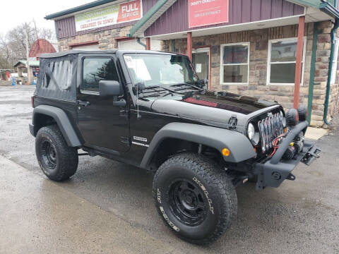 2012 Jeep Wrangler for sale at Douty Chalfa Automotive in Bellefonte PA