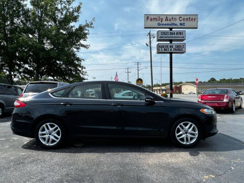 2014 Ford Fusion for sale at FAMILY AUTO CENTER in Greenville NC