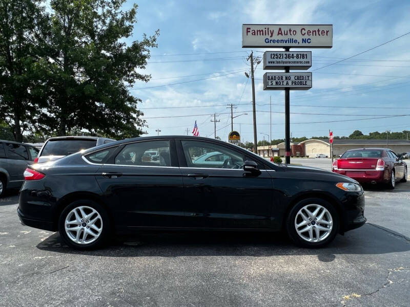 2014 Ford Fusion for sale at FAMILY AUTO CENTER in Greenville NC