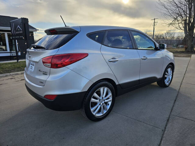 2011 Hyundai TUCSON for sale at Bigfoot Auto in Hiawatha, IA