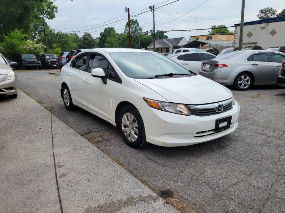 2012 Honda Civic for sale at DAGO'S AUTO SALES LLC in Dalton, GA